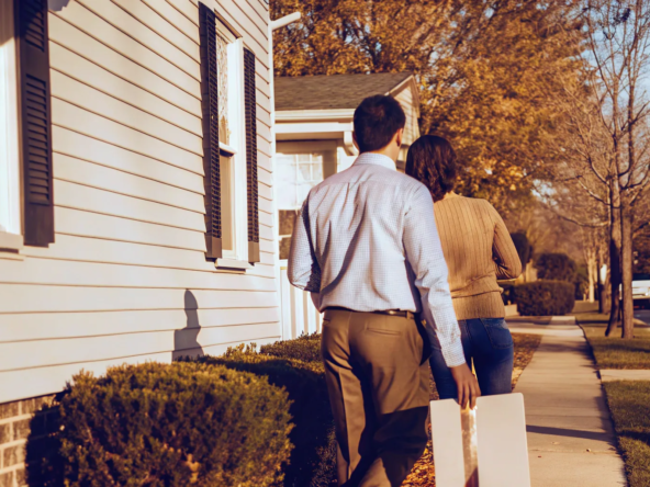 Couple discussing probate sale and cash offer on a house.