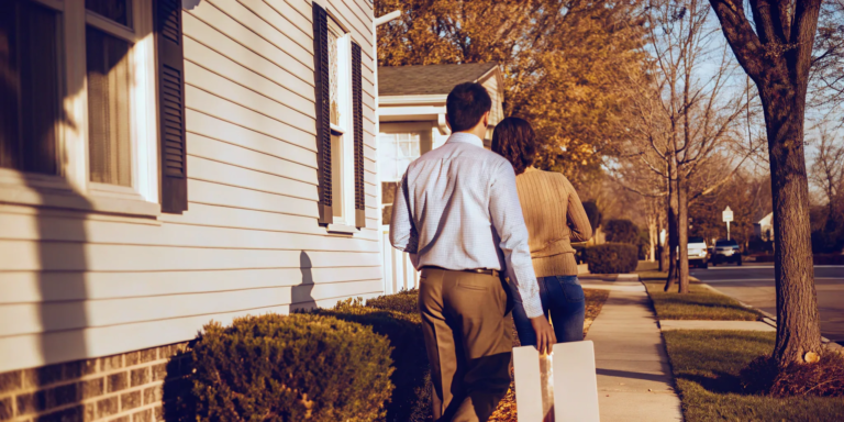 Couple discussing probate sale and cash offer on a house.
