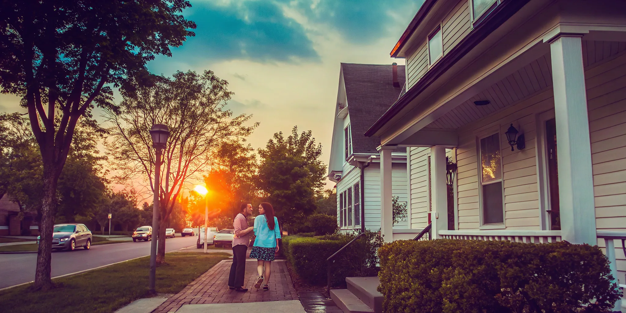 Couple in front of house for sale.
