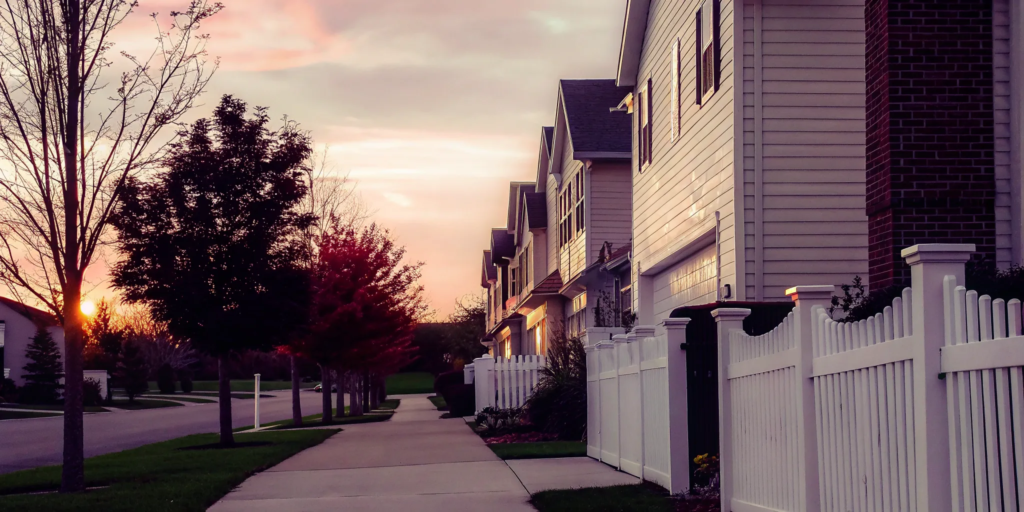 Suburban homes on a street, where a seller learns how much closing costs are without an agent.
