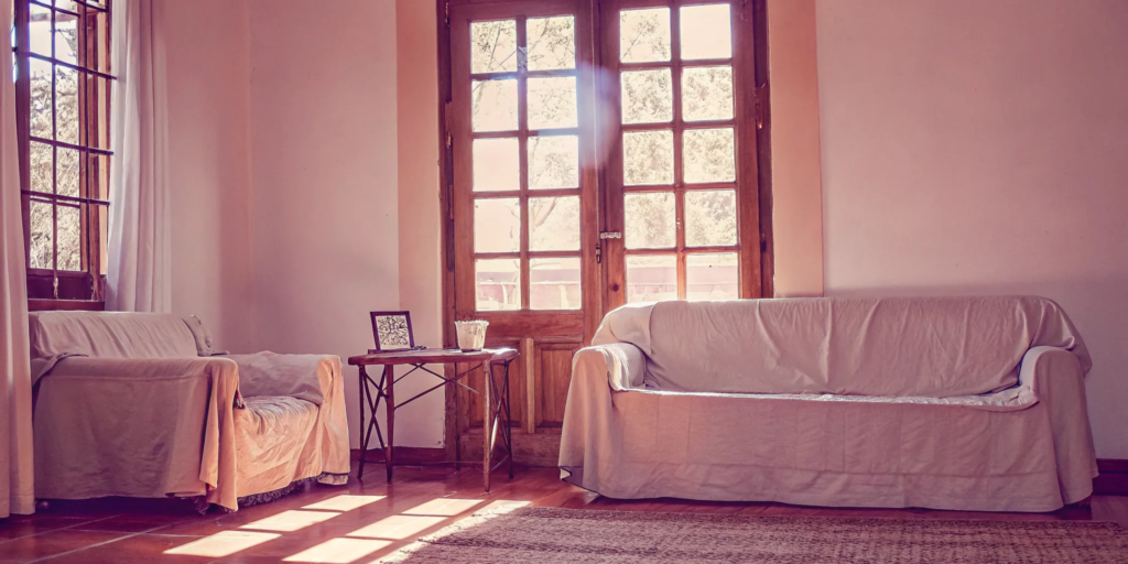 A bright living room in a house, showing why a cash offer is a better option for a seller.