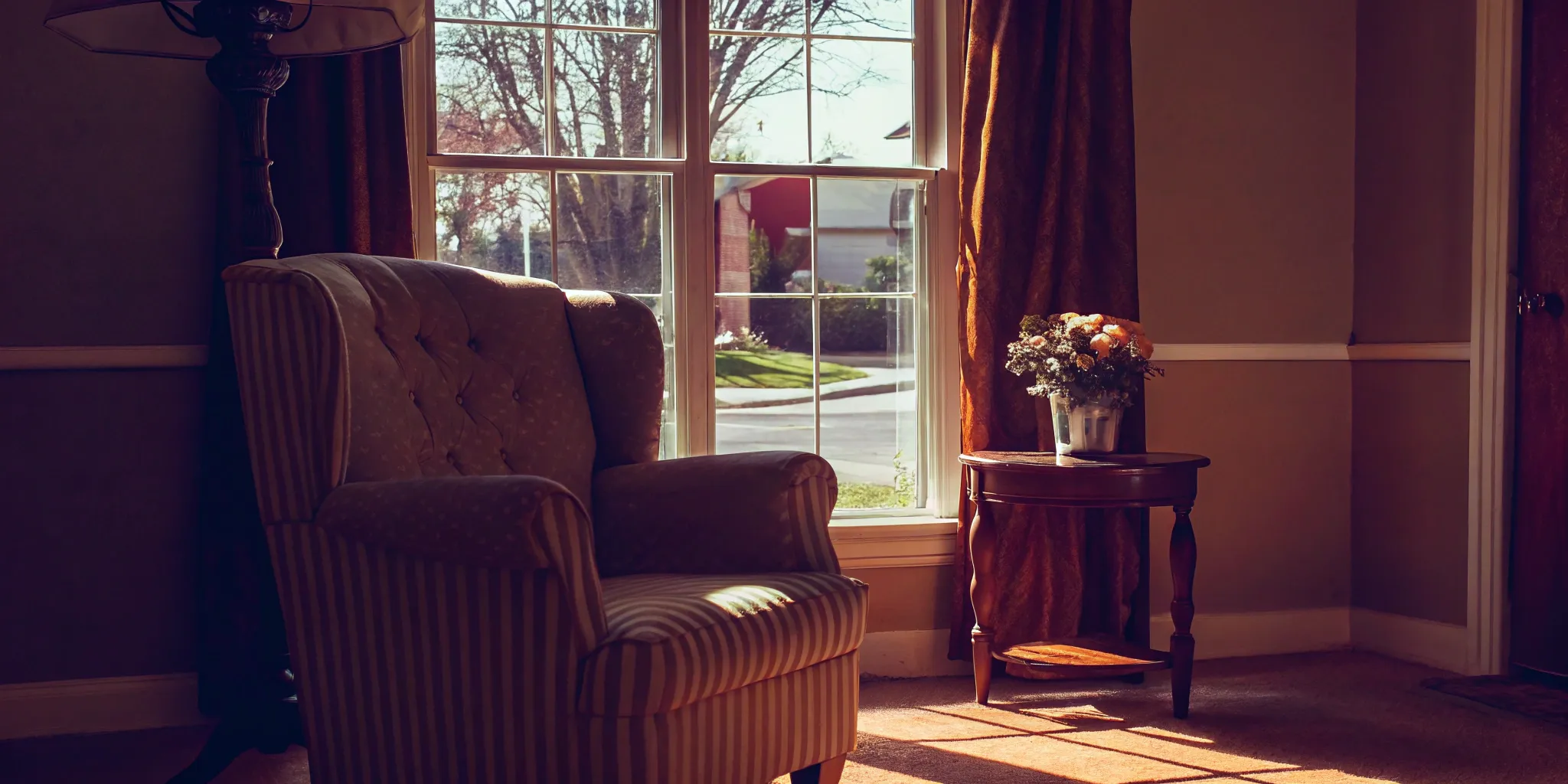 A cozy living room in a house being sold as-is to companies that buy houses fast.