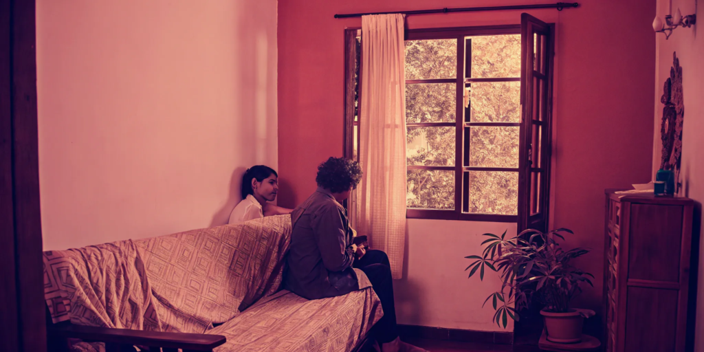 Heirs on a couch discussing how to sell a probate property.