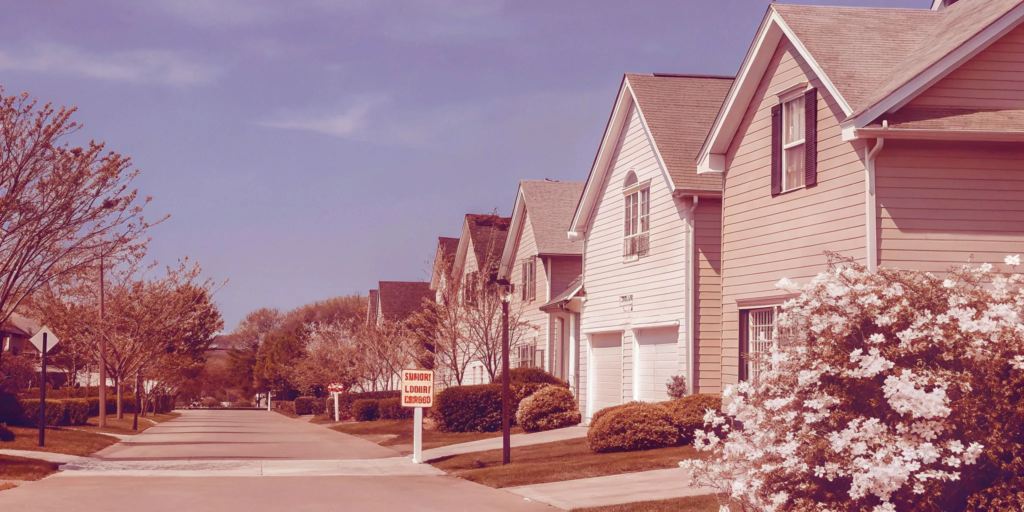 A suburban home with a yard sign that reads sell my home for cash today.