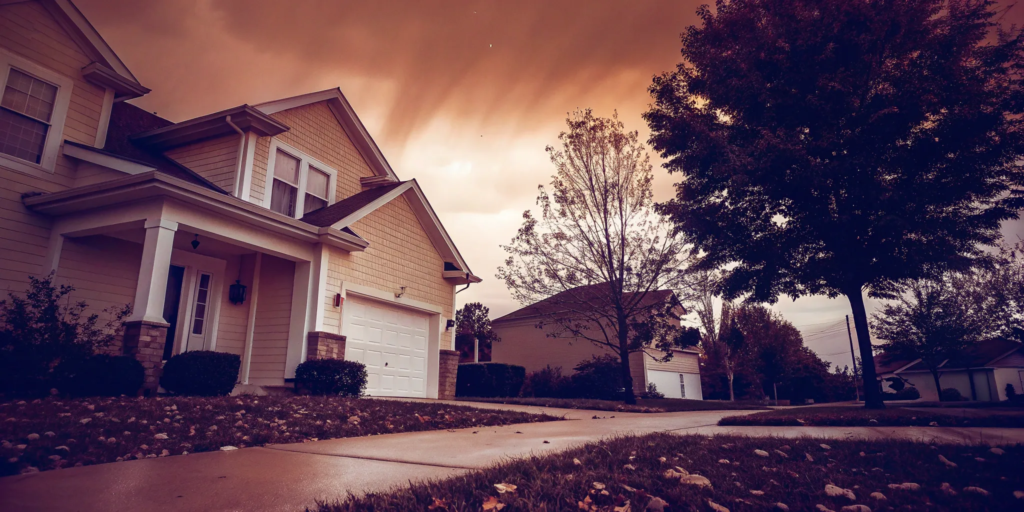 A well-kept house with a driveway, ready for a homeowner who needs to sell my house immediately.