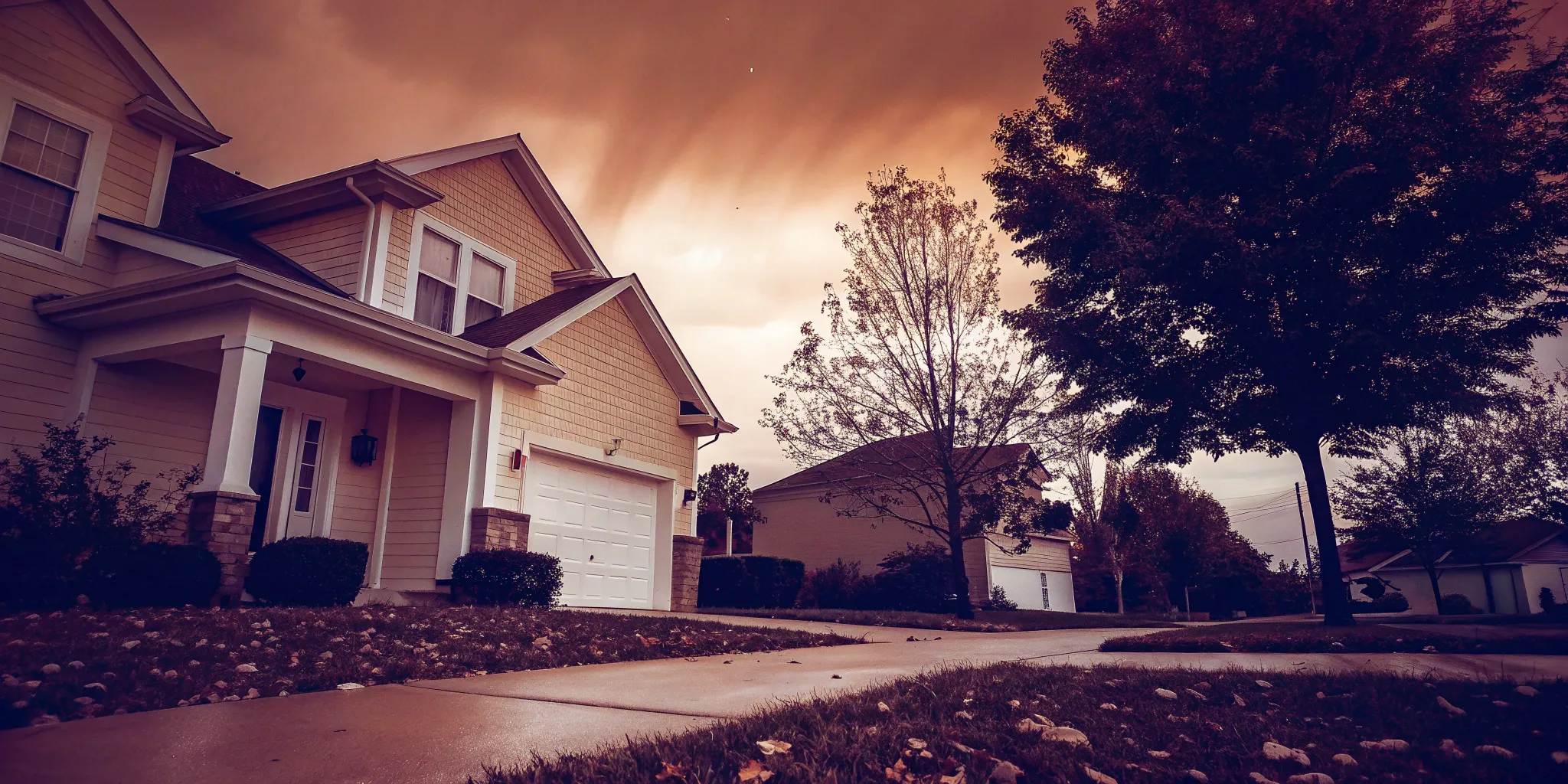 A well-kept house with a driveway, ready for a homeowner who needs to sell my house immediately.