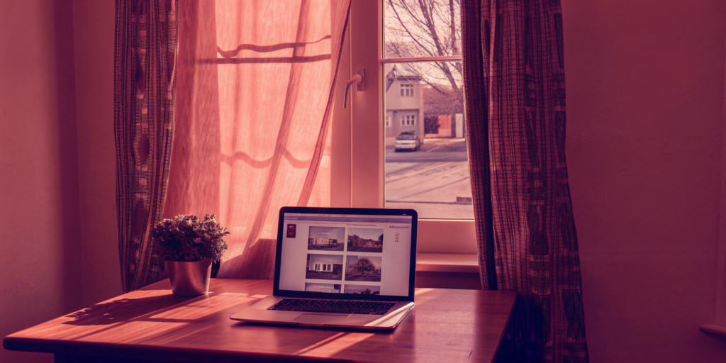 Laptop on a desk showing how to get a cash offer for a home online.