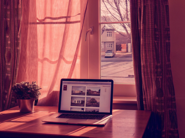 Laptop on a desk showing how to get a cash offer for a home online.