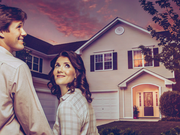 A couple in front of their house, selling it without paying closing costs.