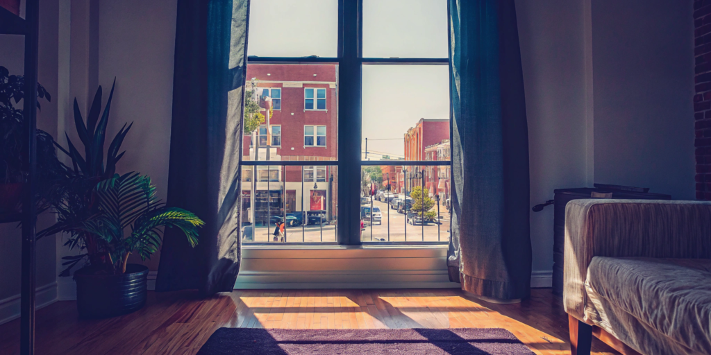 Bright condo living room with hardwood floors, ready to sell as is.