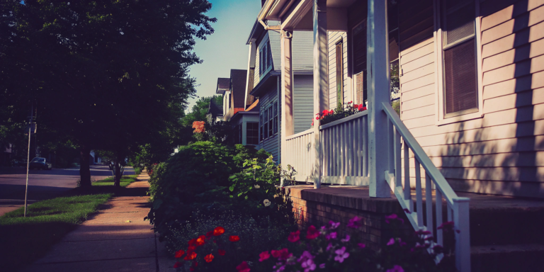A row of houses on a residential street in Cicero we buy for cash.