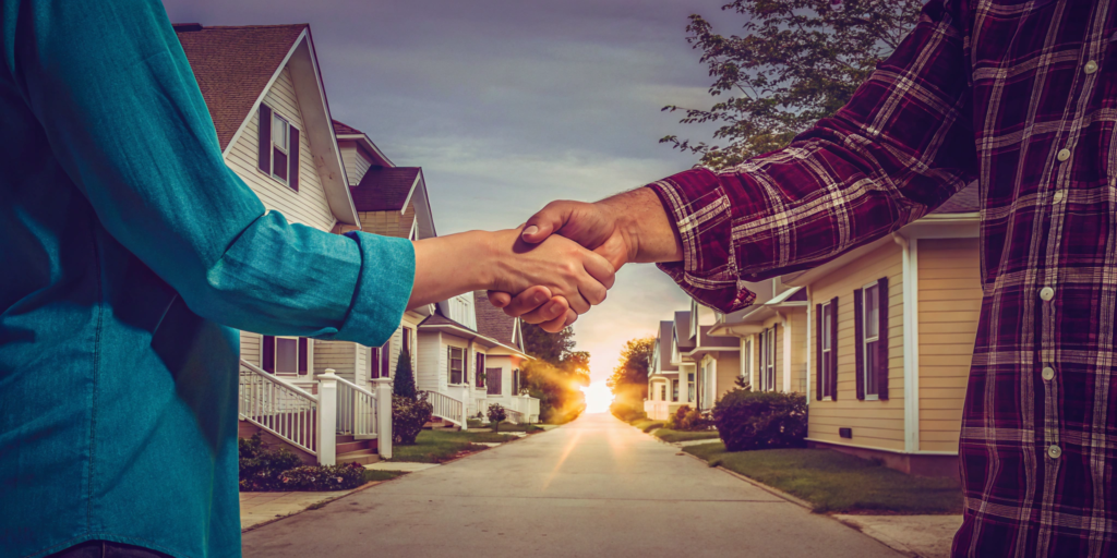 A homeowner and a legit cash home buyer shake hands, finalizing a trustworthy home sale.