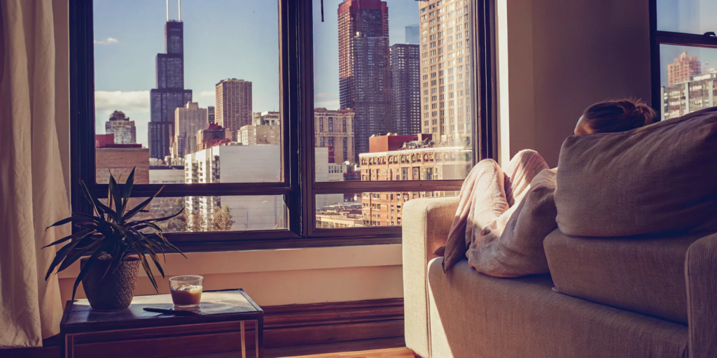 A woman relaxes in her Chicago condo, ready to sell her property for cash.