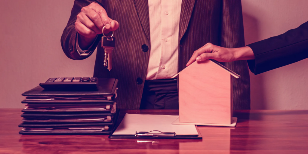 A landlord completes a cash offer sale for a rental property by handing over the keys.