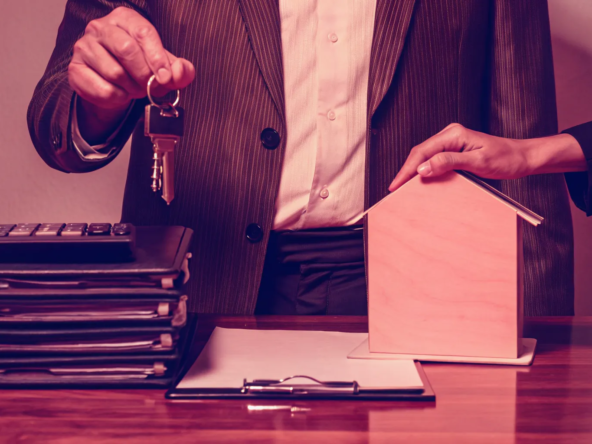 A landlord completes a cash offer sale for a rental property by handing over the keys.