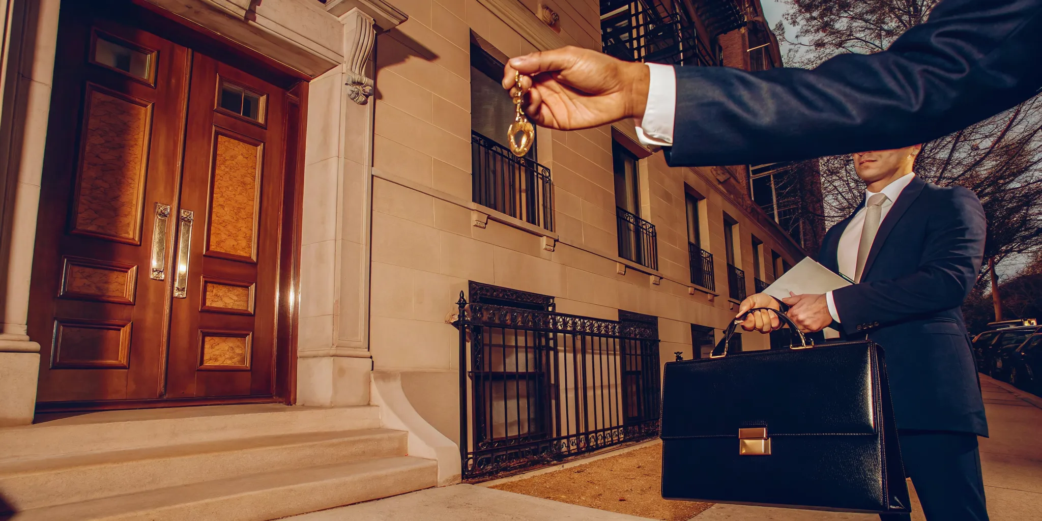 A person holding the keys to an inherited house they are preparing to sell in Cook County.