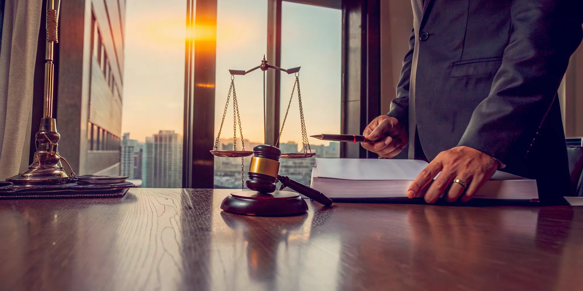 A lawyer reviews documents to sell a probate property in Cook County, with a gavel on the desk.